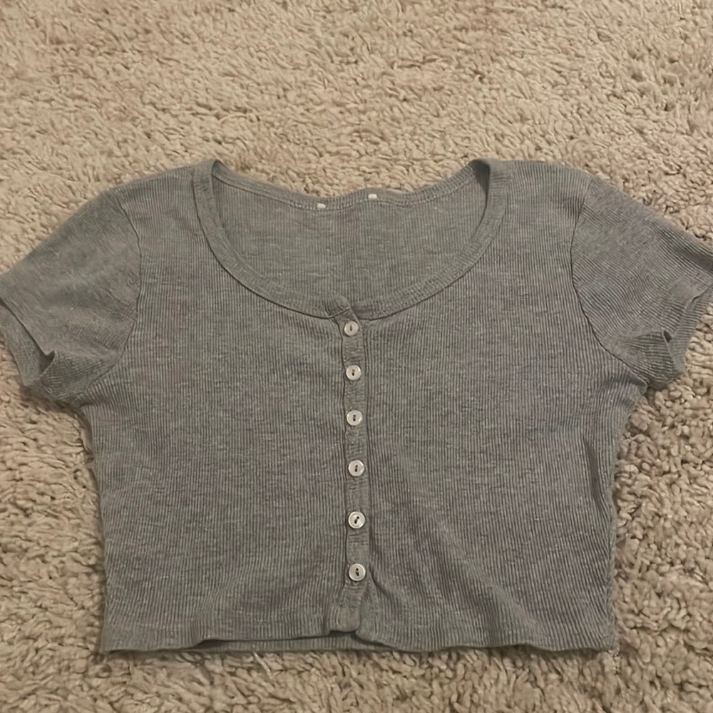 gray shit with white buttons going down the middle!